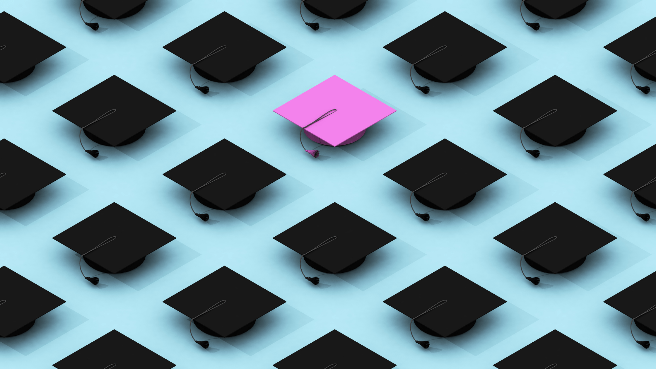 One pink among black graduate hats, perfectly aligned on a light blue canvas.